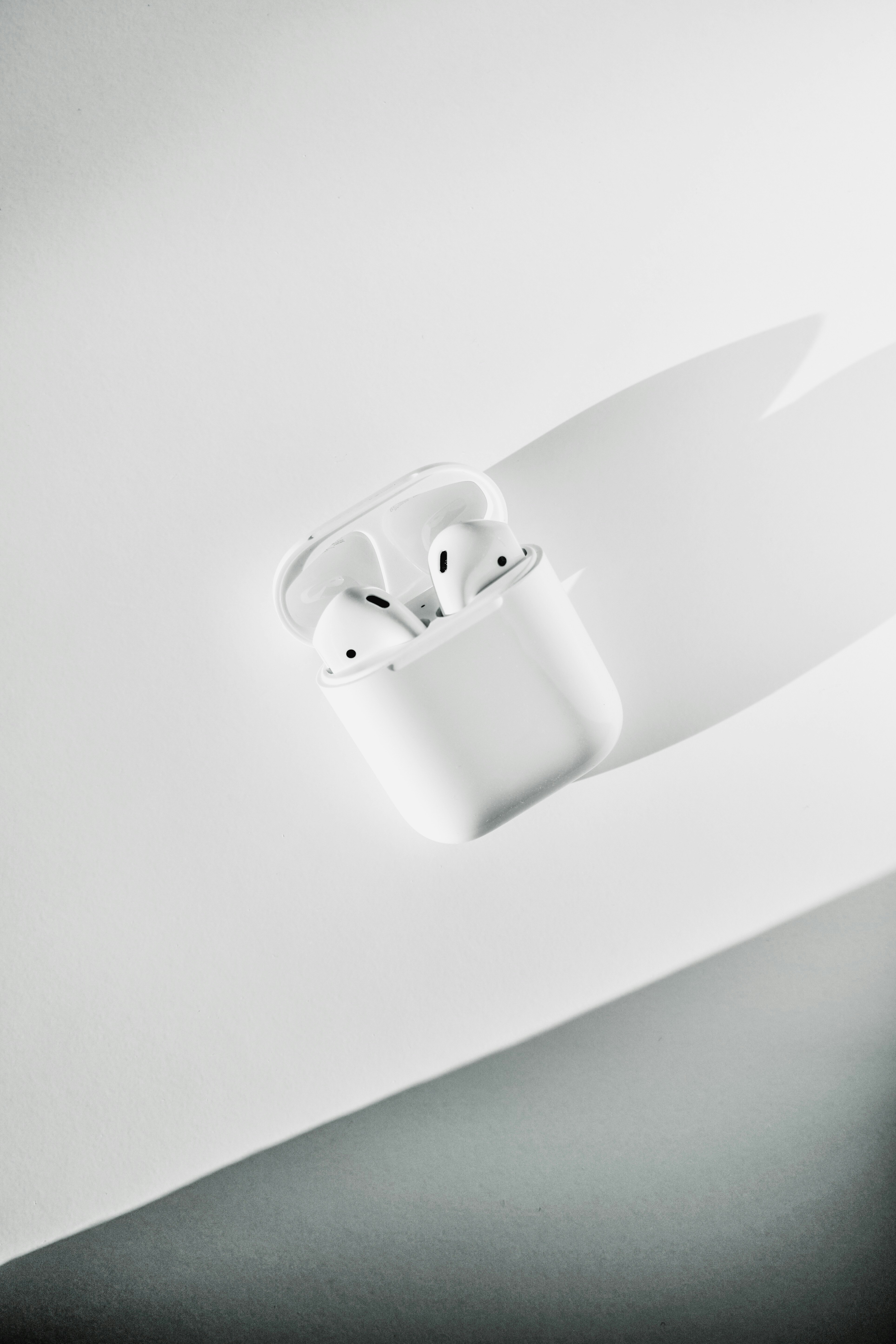 white apple earpods in white case